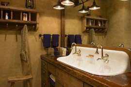 Sparkling sink seems perfect for the dark, rustic bathroom [Design: Locati Architects]