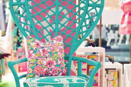 Turquoise peacock chair with vibrant cushions