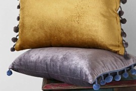 Velvet pom pom pillows from Urban Outfitters