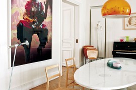 Wall art and pendant lighting bring color to the dining room