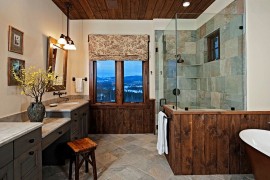 Wood panels and glass shower area for the modern rustic bathroom [Design: Bulhon Design Associates]