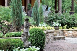 Garden statues next to the garden pathway are a classic look