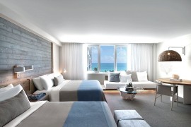 Beach style interiors of the room complement the setting outside