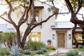 Beautiful stucco home with native landscaping