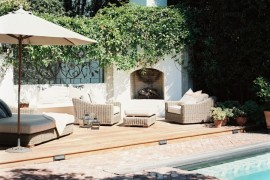 Brick patio beside a wooden deck