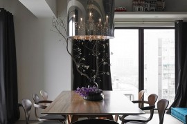Cherner chairs at the dining room with a smart chandelier on top