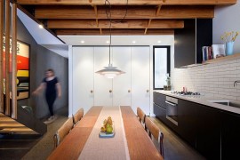 Classic pendant lighting above the dining with cool ambient illumination