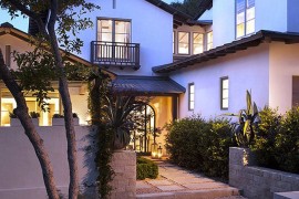 Classic stucco home with a modern walkway