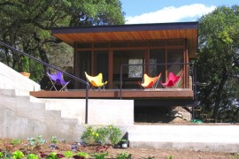 Colorful seating outside of a screened-in porch