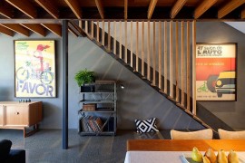 Colorful wall art and lighting add to the dark interior