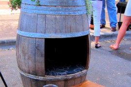 Old wine barrel turned into a doghouse