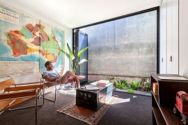 Foldable glass doors connect the interior with the outdoors