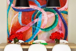 It is the art piece that sets the mood in this dining room