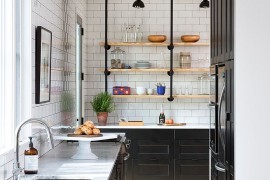 Lovely use of black inside the narrow Scandinavian kitchen