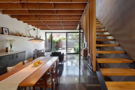 Lower level sitting area alongw ith kitchen and dining
