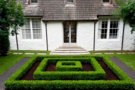 Manicured hedges provide a maze-like focal point