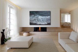 Minimal living room with wall art inspired by nature hanging above the fireplace [From: John Wolf Fine Art]