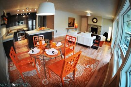 Orange gives the dining space a unique identity