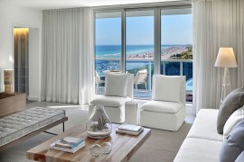 Pristine white drapes allow you to switch between ocean views and complete privacy