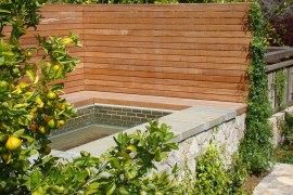 Privacy fence surrounding a custom-built spa
