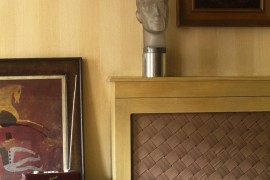 Radiator cover with a woven front