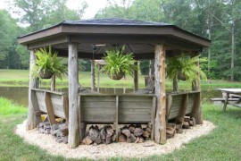 Rustic gazebo with potted ferns