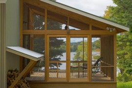 Screened-in lake house porch with a view