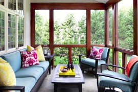 Screened-in porch with colorful throw pillows