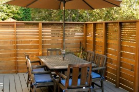 Slatted outdoor privacy fence