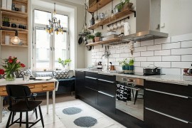 Small and stylish Scandinavian kitchen with breakfast nook and floating wooden shelves