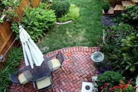 Small backyard with a brick patio