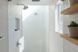 Sparkling white shower with glass doors