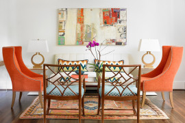 Transitional living room with pops of orange