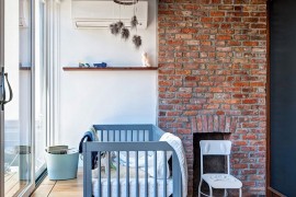 Vintage brick fireplace in the modern nursery