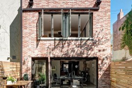 Weathered brick walls of the Brooklyn home gve it a timeless appeal