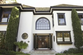 White stucco home with dark trim