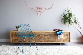 Wiry wall art in the living room in orange [From: Bend Goods]