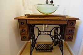 Old sewing machine used as DIY bathroom vanity
