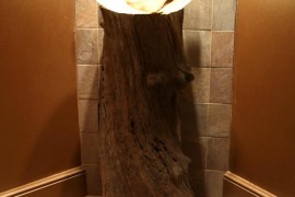 Gorgeous tree trunk bathroom vanity design with smart lighting