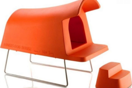 Stylish doghouse with stepping stool in matching orange