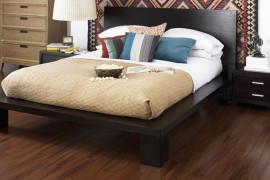 Bedroom with hardwood floor and a colorful backdrop