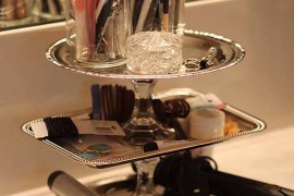 Use a tiered tray to store makeup and hair accessories
