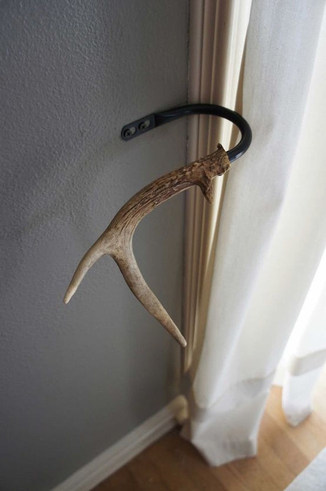 Antlers used as tie backs for curtains
