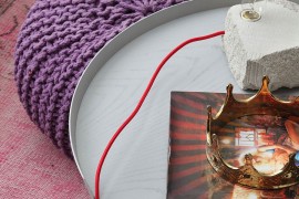 Beautiful coffee table decorating ideas with a plsu purple ottoman next to it