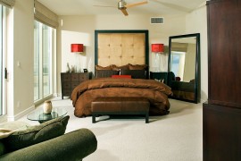 Bedside lamps with bright red shades steals the show here