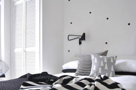 Black polka dot wall decals combined with other bedding patterns