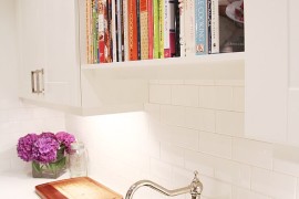 Bookshelf directly above kitchen sink