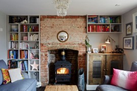 Brick alcove in the small eclectic living room for the fireplace [Design: Hart Design And Construction]