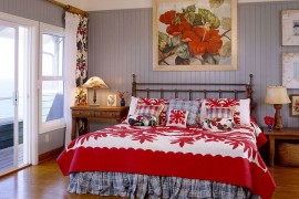 Bright, fabulous bedding and wall art in red highlight the tropical theme