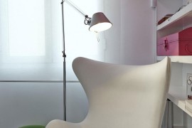 Bright red lighting above the Arne Jacobsen Egg Chair